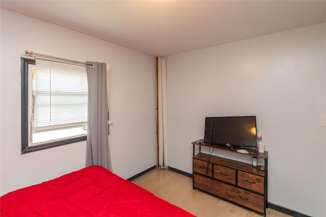 bedroom with light wood-type flooring