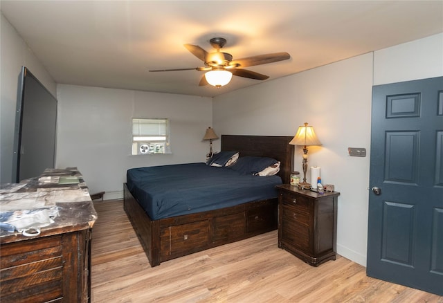 bedroom featuring ceiling fan and light hardwood / wood-style flooring