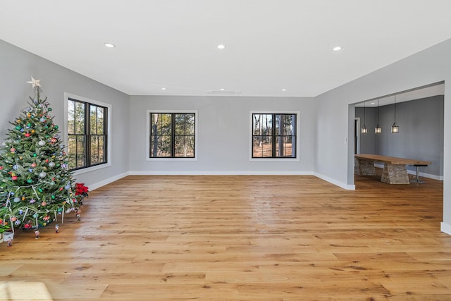 unfurnished living room featuring light hardwood / wood-style flooring