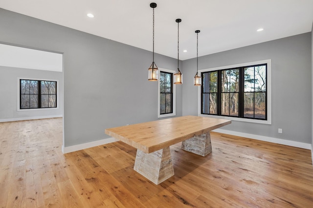 unfurnished dining area with light wood-type flooring and a wealth of natural light