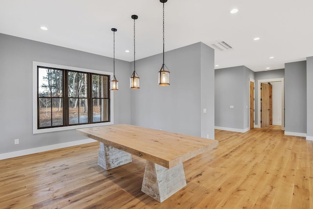 dining area with light hardwood / wood-style flooring