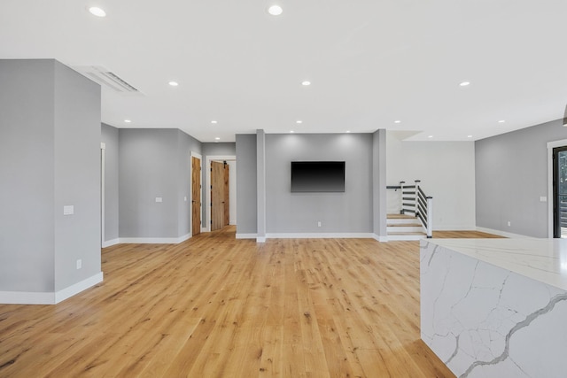 unfurnished living room with light wood-type flooring