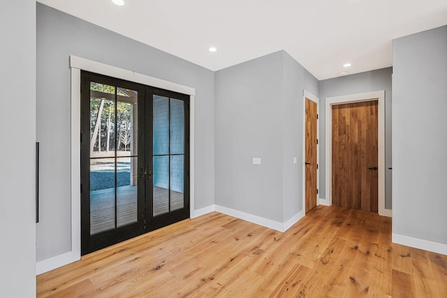 doorway featuring french doors and light wood-type flooring