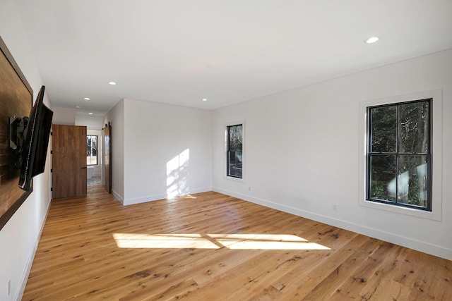 unfurnished room featuring light hardwood / wood-style flooring