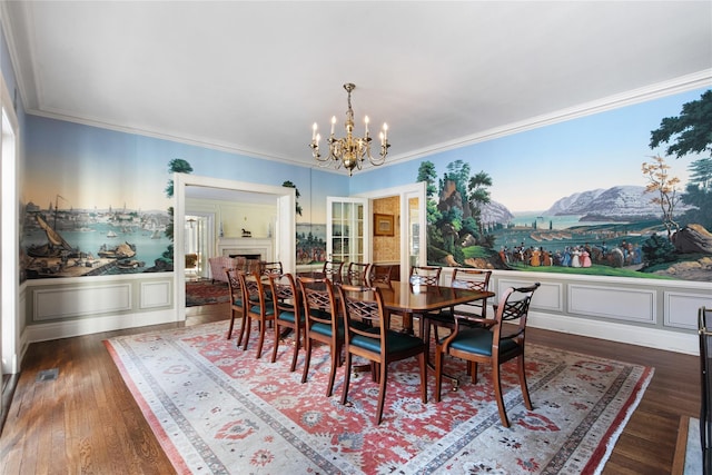 dining room with a chandelier, ornamental molding, dark hardwood / wood-style floors, and a mountain view