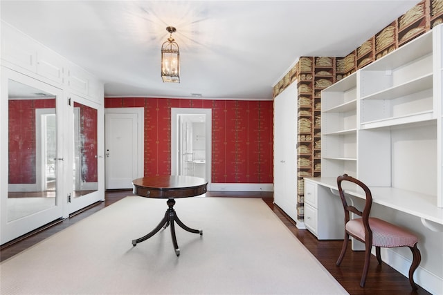 interior space featuring dark hardwood / wood-style flooring and built in desk