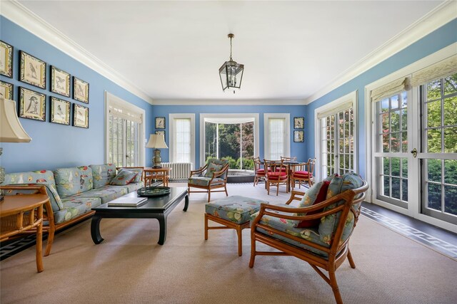 36 Revolutionary Rd, Briarcliff Manor, NY 10510 - carpeted living room with healthy amount of natural light and ornamental molding