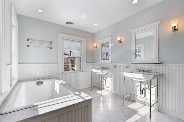 36 Revolutionary Rd, Briarcliff Manor, NY 10510 - full bathroom with wainscoting, a garden tub, marble finish flooring, and recessed lighting