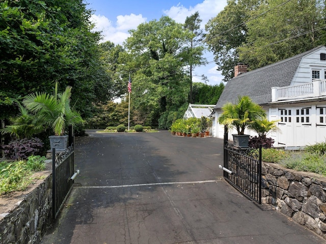 36 Revolutionary Rd, Briarcliff Manor, NY 10510 - view of asphalt driveway with a gated entry and a gate