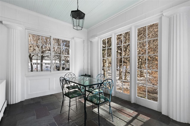 36 Revolutionary Rd, Briarcliff Manor, NY 10510 - dining room with stone tile floors, crown molding, a decorative wall, and decorative columns