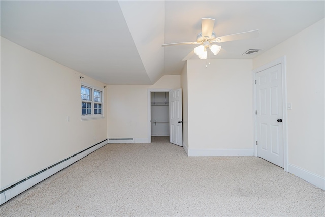 carpeted empty room featuring ceiling fan, a baseboard radiator, and lofted ceiling