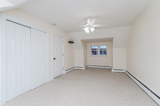 bonus room with vaulted ceiling, baseboard heating, and ceiling fan