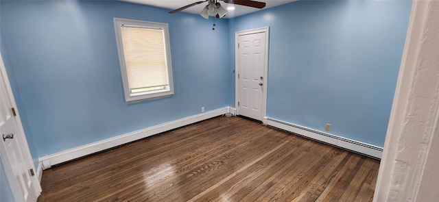 spare room featuring a baseboard radiator, dark hardwood / wood-style floors, and ceiling fan