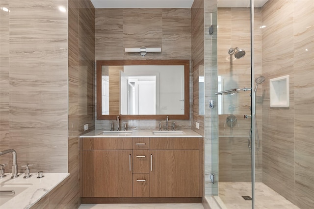 bathroom featuring tile walls, walk in shower, and vanity