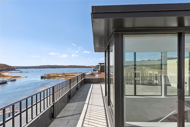 balcony featuring a water view