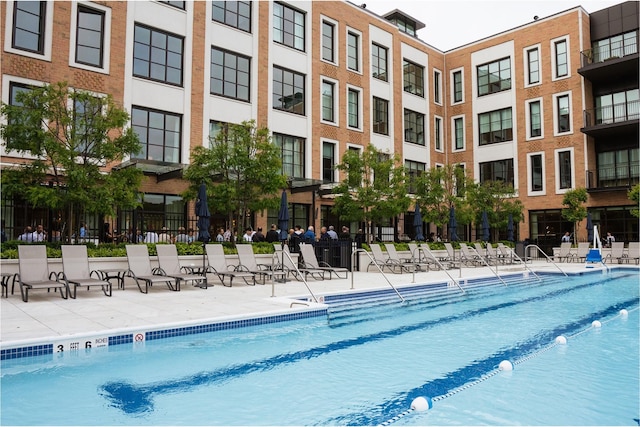 view of swimming pool featuring a patio area