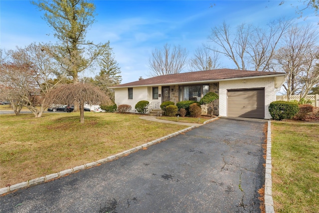 single story home with a front yard and a garage