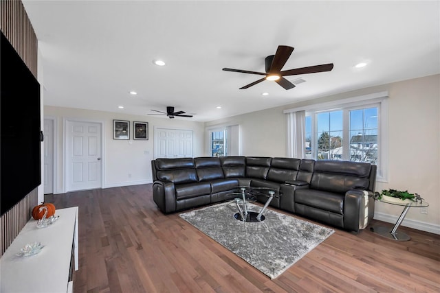 living room with hardwood / wood-style floors and ceiling fan