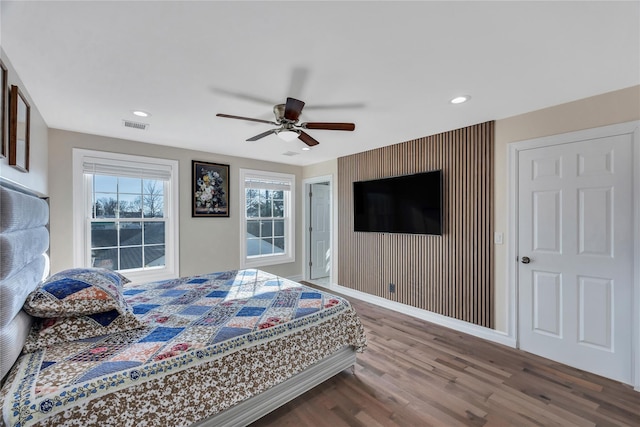 bedroom featuring hardwood / wood-style flooring and ceiling fan