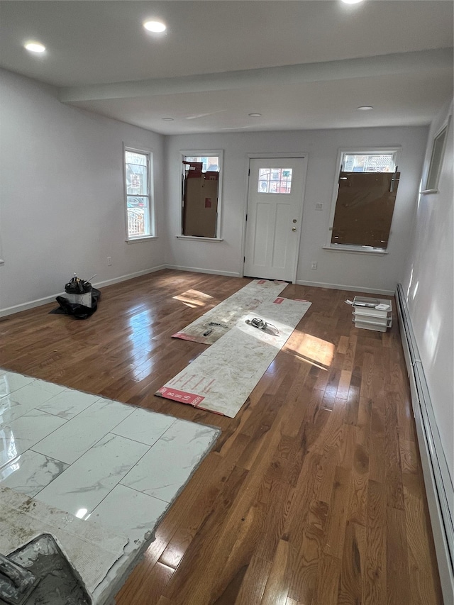 entryway with dark hardwood / wood-style flooring and a baseboard radiator