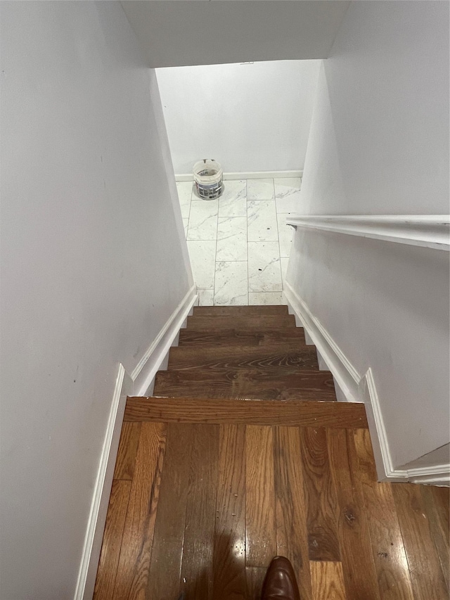 stairway with wood-type flooring