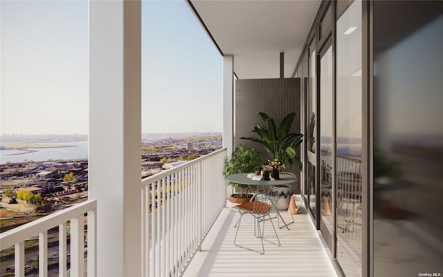 balcony featuring a water view