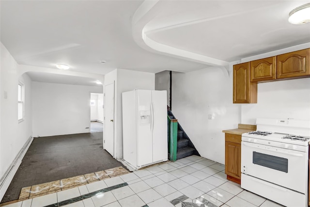 kitchen with light tile patterned floors and white appliances