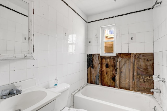 bathroom with tasteful backsplash, sink, tile walls, toilet, and a bathing tub