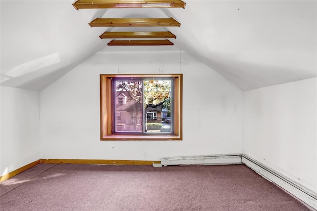 additional living space with baseboard heating, carpet floors, and lofted ceiling with beams