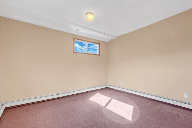 empty room with baseboard heating and carpet floors