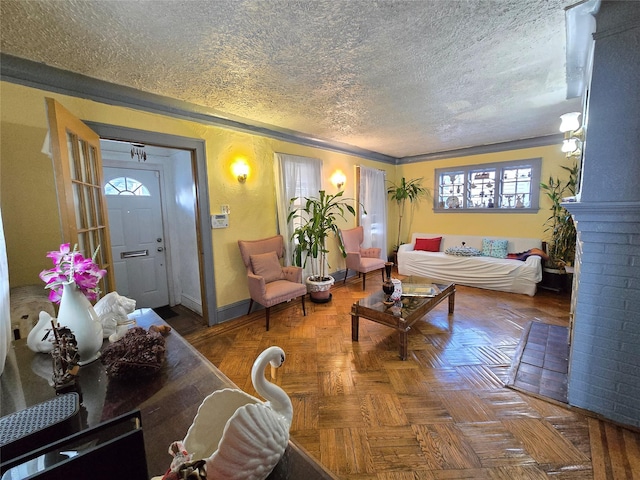 living room featuring crown molding, a textured ceiling, and parquet flooring