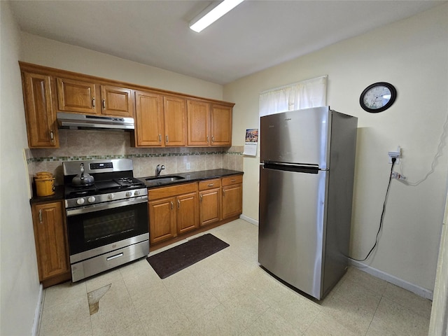 kitchen featuring sink, stainless steel appliances, and tasteful backsplash