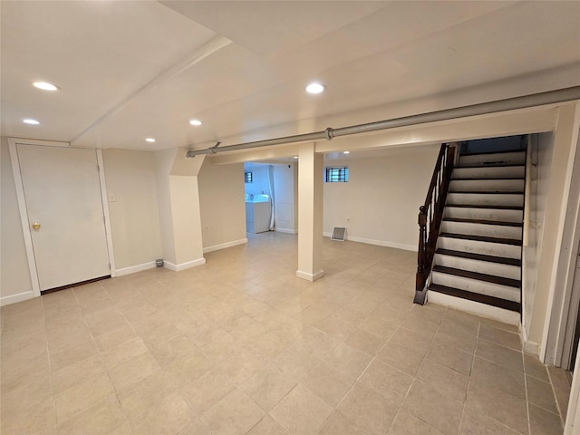 basement featuring washing machine and clothes dryer