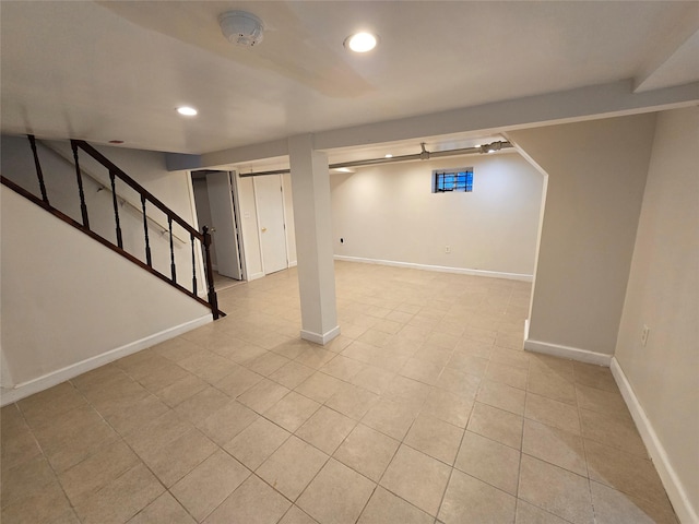 basement featuring light tile patterned floors