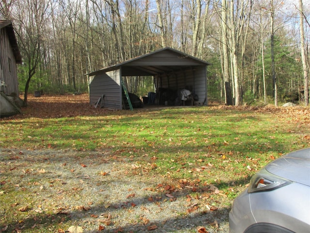 exterior space featuring a carport and a yard