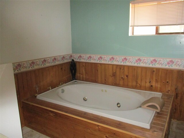 bathroom with tiled tub