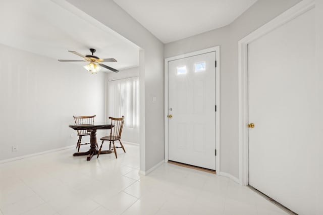 entrance foyer with ceiling fan