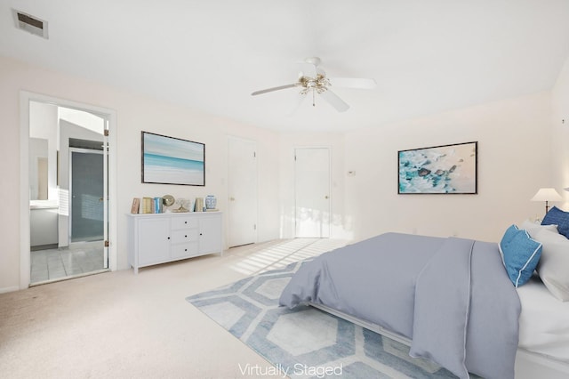 bedroom featuring ceiling fan and light colored carpet