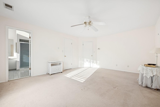 unfurnished bedroom with ceiling fan and light carpet