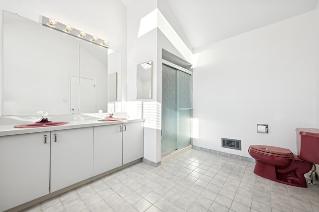 bathroom featuring vanity, tile patterned floors, and walk in shower