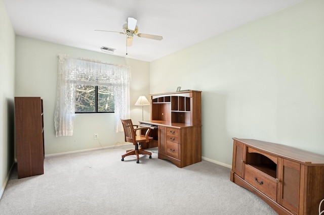 office with light carpet and ceiling fan