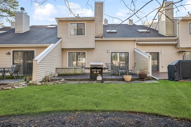 rear view of house with a yard