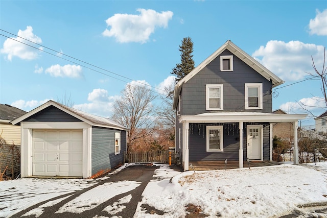 front facade featuring an outbuilding and a garage