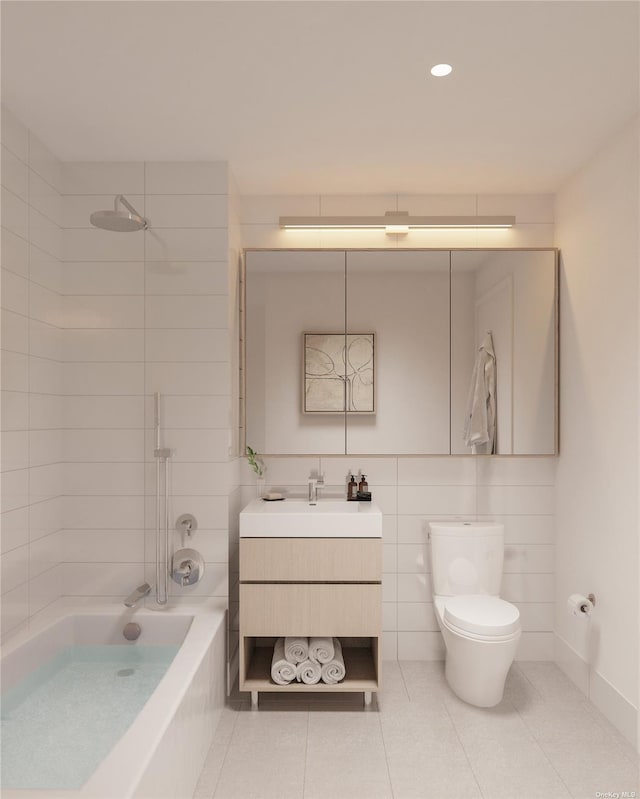 full bathroom featuring tile patterned flooring, vanity, tiled shower / bath combo, and toilet