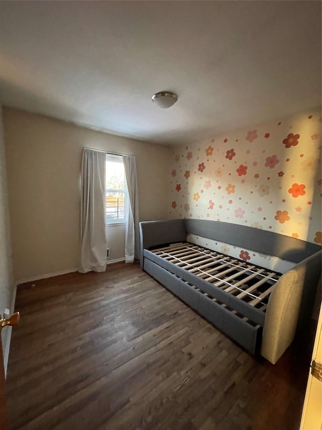 unfurnished bedroom featuring dark hardwood / wood-style floors