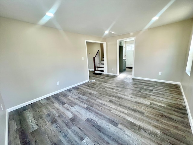 spare room featuring hardwood / wood-style flooring