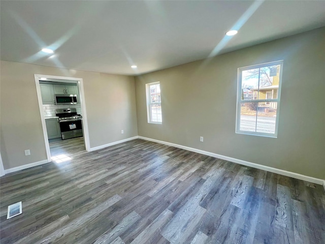 unfurnished living room featuring hardwood / wood-style floors