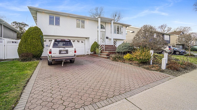 split foyer home featuring a garage