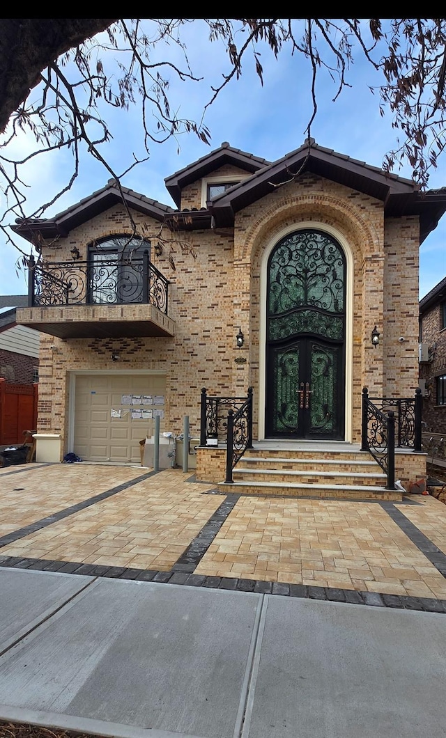 doorway to property with french doors and a garage