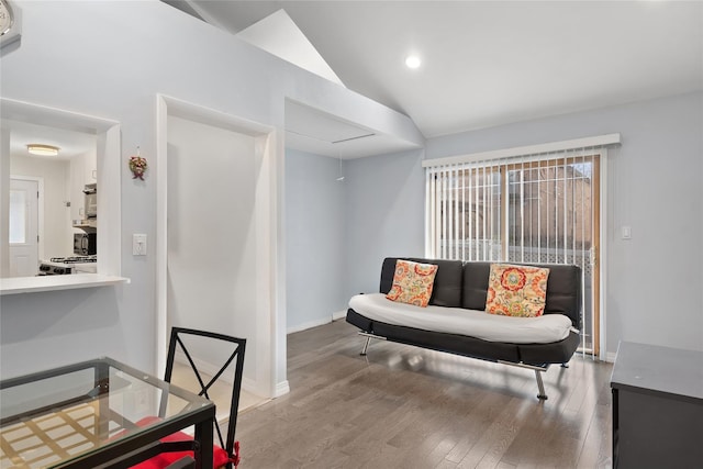 sitting room featuring wood-type flooring and lofted ceiling